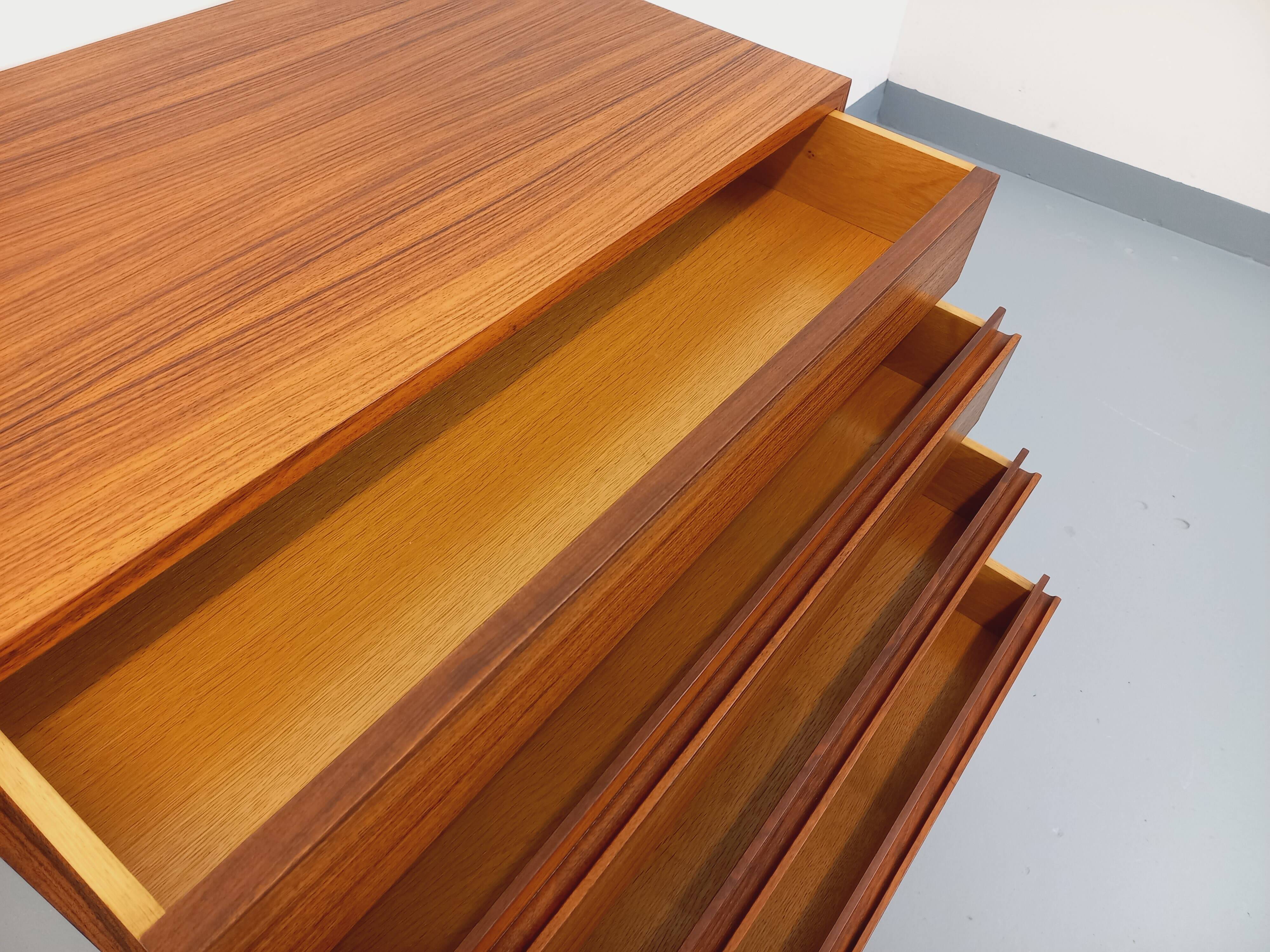 Vintage Scandinavian modernist chest of drawers in rosewood and black metal.