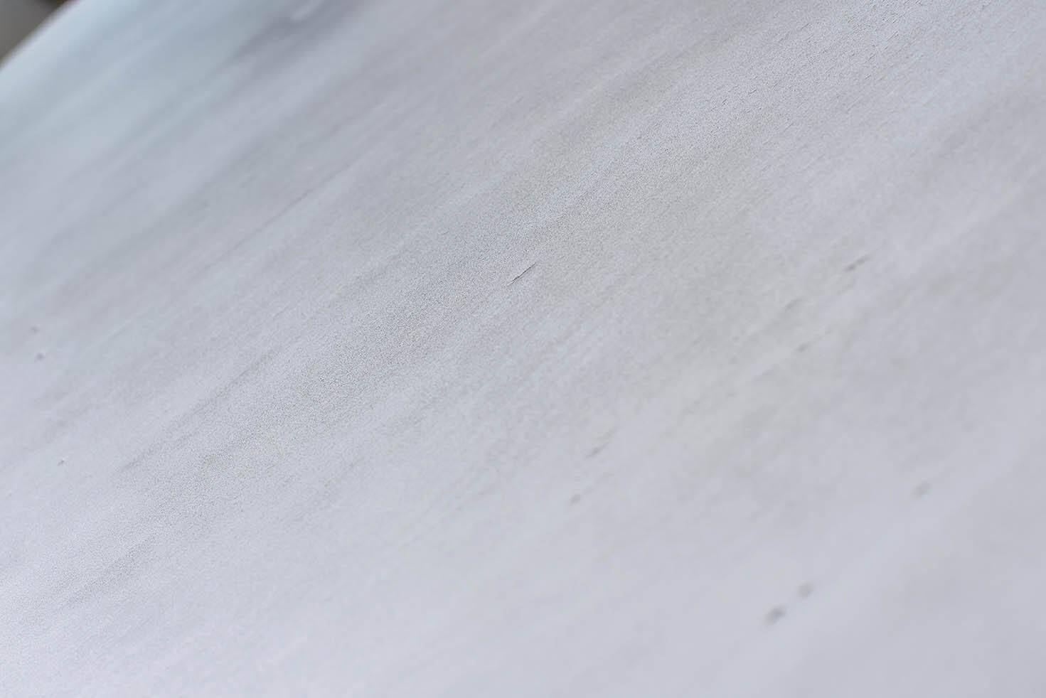 Round Art Deco black painted wooden side table with lower shelf, 1930s.