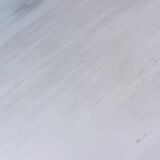 Round Art Deco black painted wooden side table with lower shelf, 1930s.