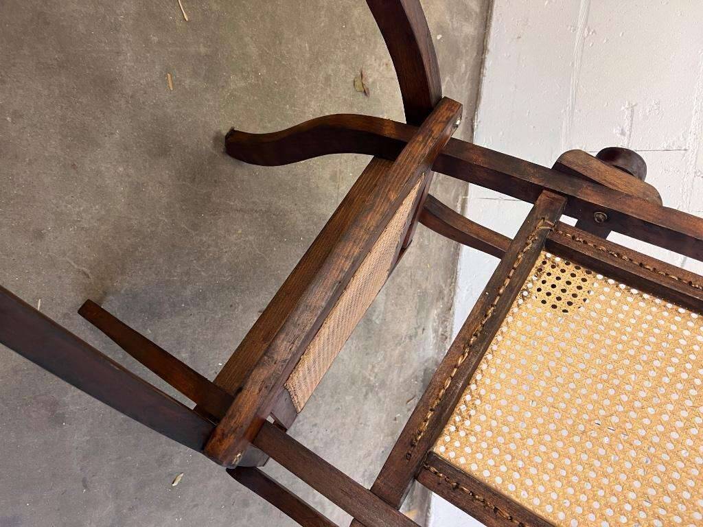 Antique folding chair with weaved seat/back