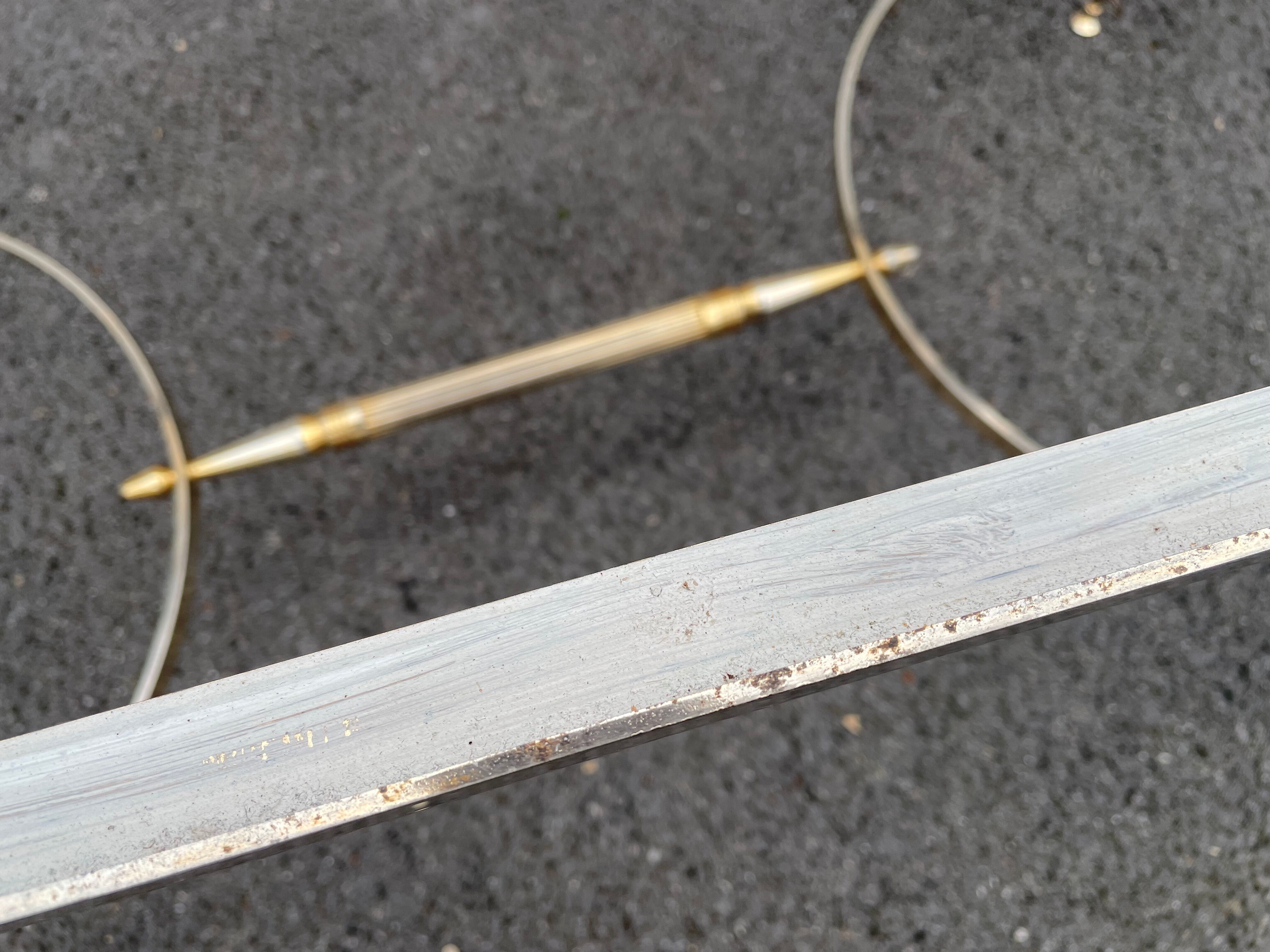 Coffee table in gilded brass and veined green marble