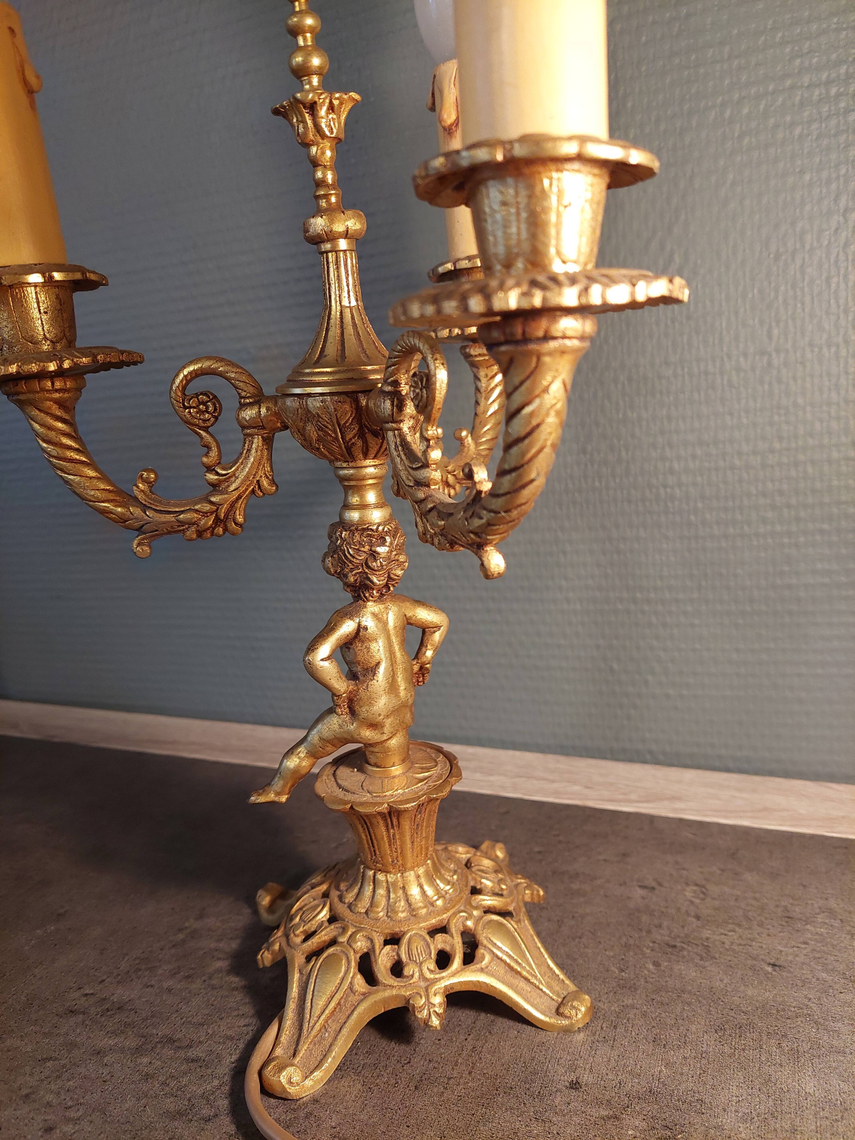 Electrified three-spoke brass candlesticks