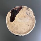 Black vase with yellow flowers