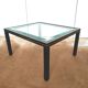 Table basse verre biseauté et métal noir et doré