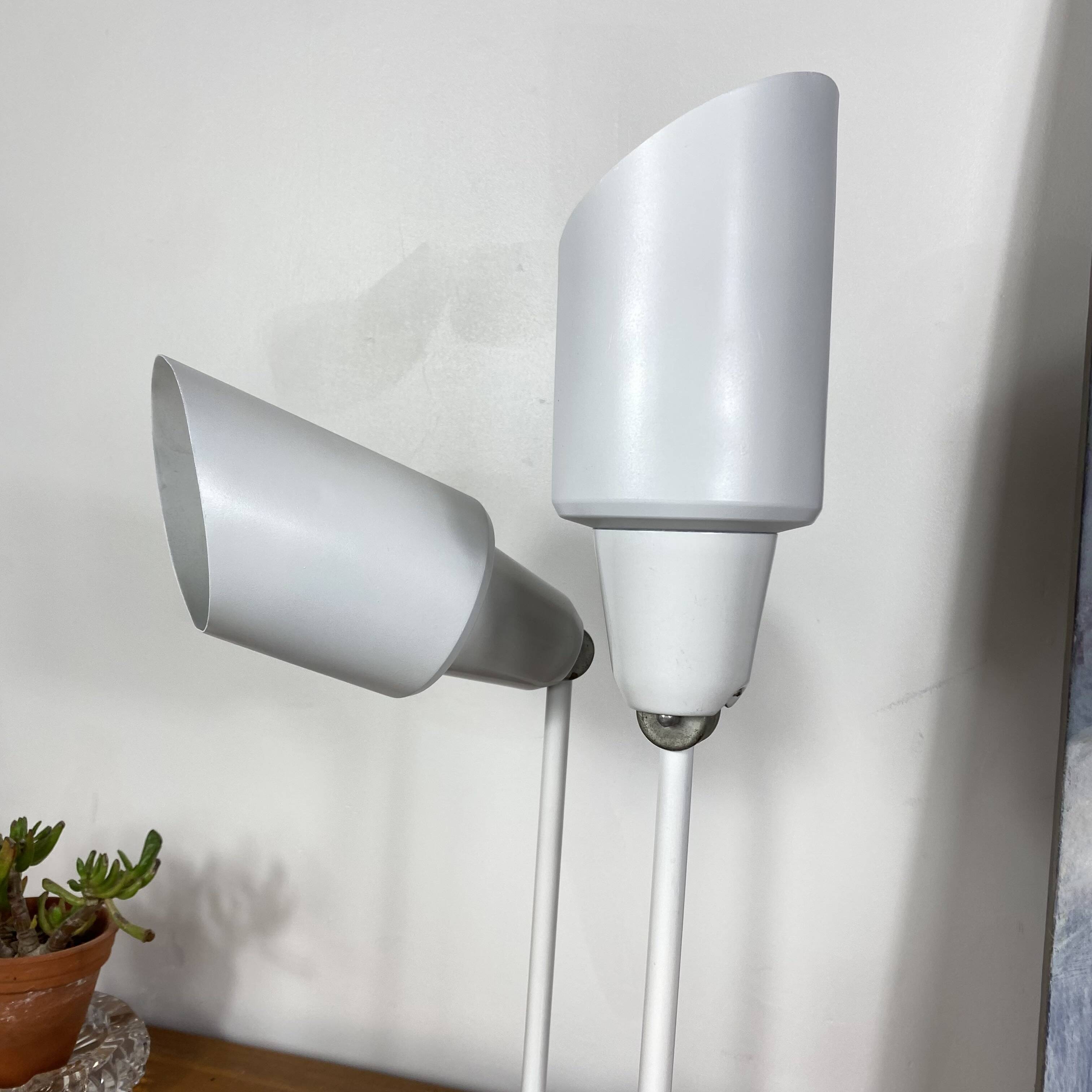 Pair of old industrial adjustable wall sconces in white metal.