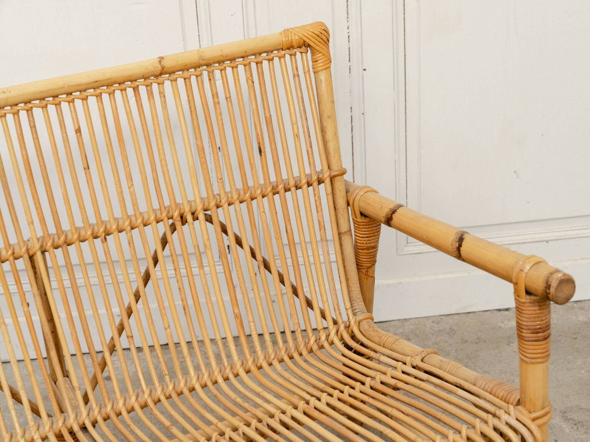 Vintage bamboo and rattan bench from the 1970s.