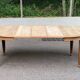 Large stripped solid oak dining table in Louis XVI style with 3 extensions.