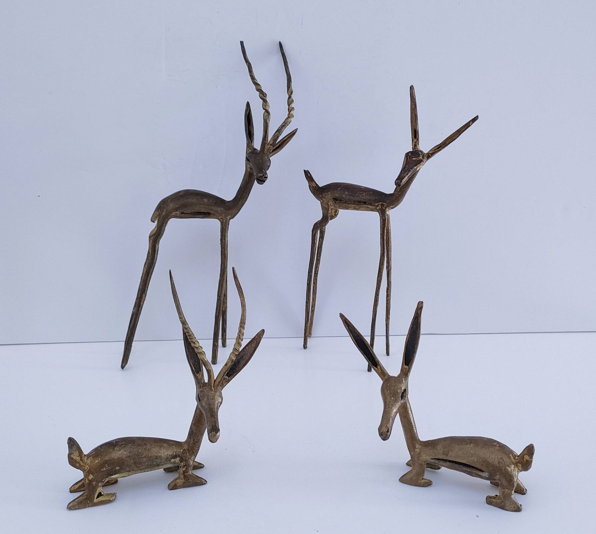 four vintage brass gazelle antelope sculptures