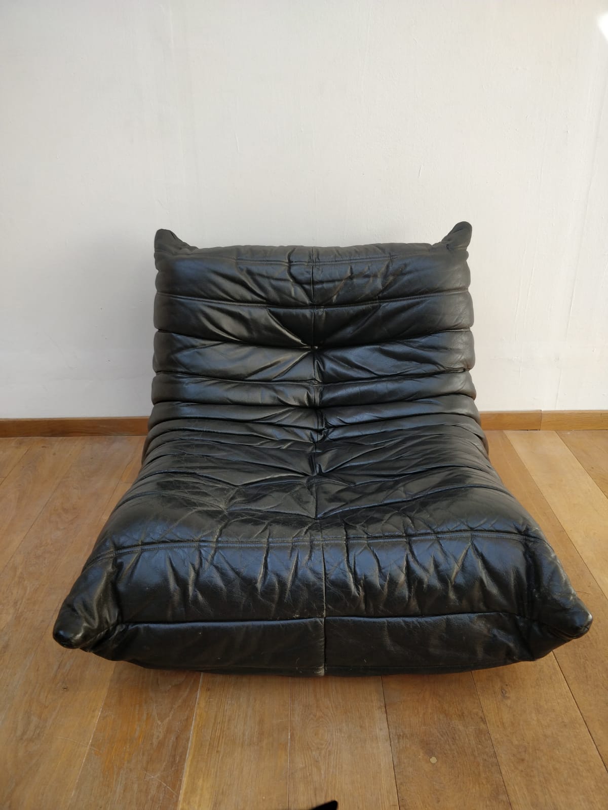 Togo in black leather by Ligne Roset
