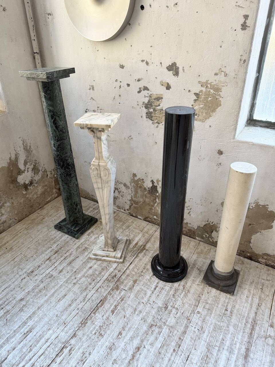 Set of 4 marble columns or pedestals.