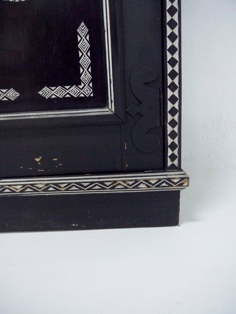 Antique wooden cabinet painted in black and with incised white painted decorations, Ettore Zaccari, Italy c 1910