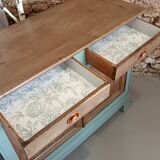 Buffet made of natural wood and bronze green.