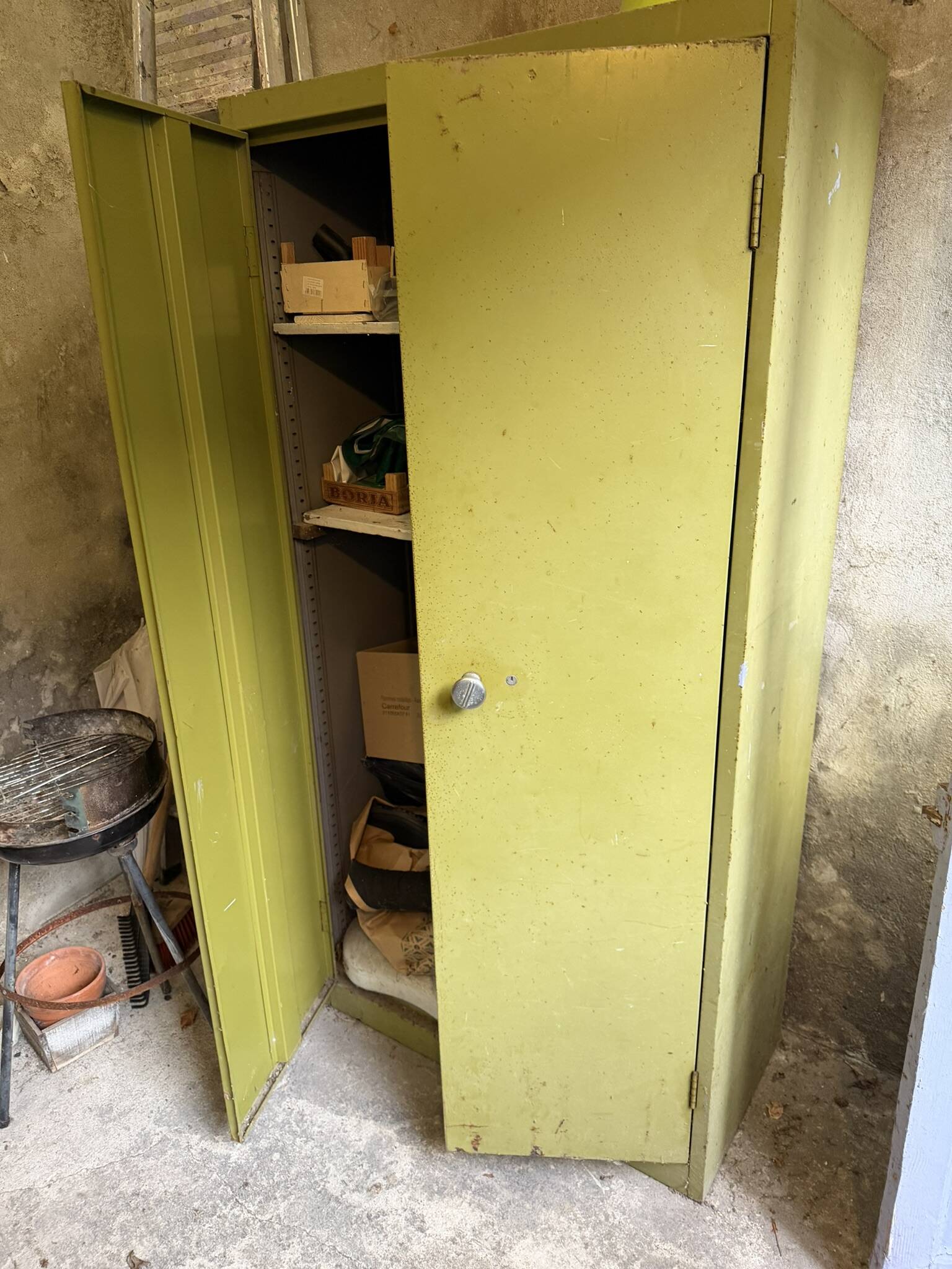 Green metal wardrobe in military style
