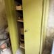 Green metal wardrobe in military style