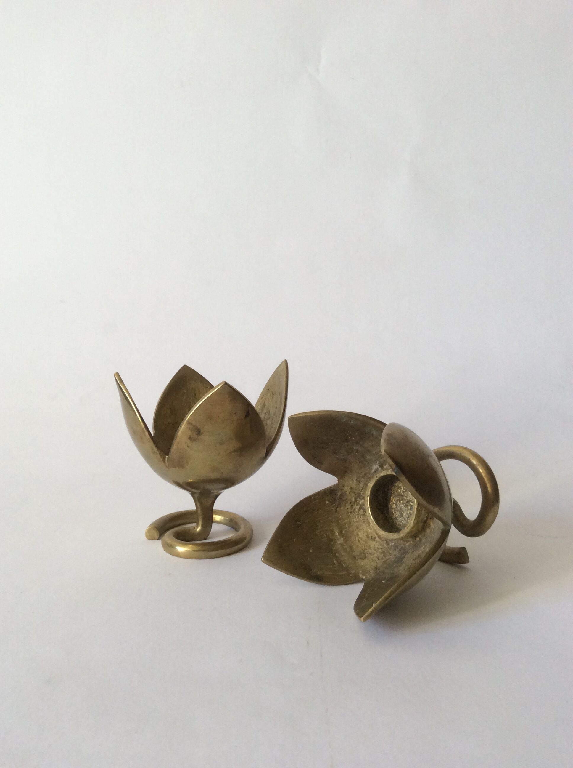 Pair of brass lotus flower candlesticks