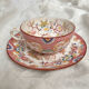 Tasse à café en faïence fine décor Minton rose Sarreguemines