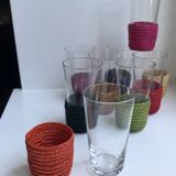 set of 9 small glasses with colored rattan support from the 70s