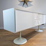 A vintage mid century space age sideboard with white sliding doors