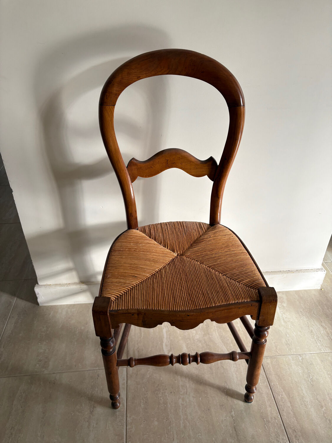 Antique wooden chair with woven straw seat – rustic style