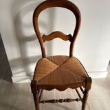 Antique wooden chair with woven straw seat – rustic style