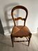 Antique wooden chair with woven straw seat – rustic style