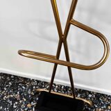 Coat rack on golden stand