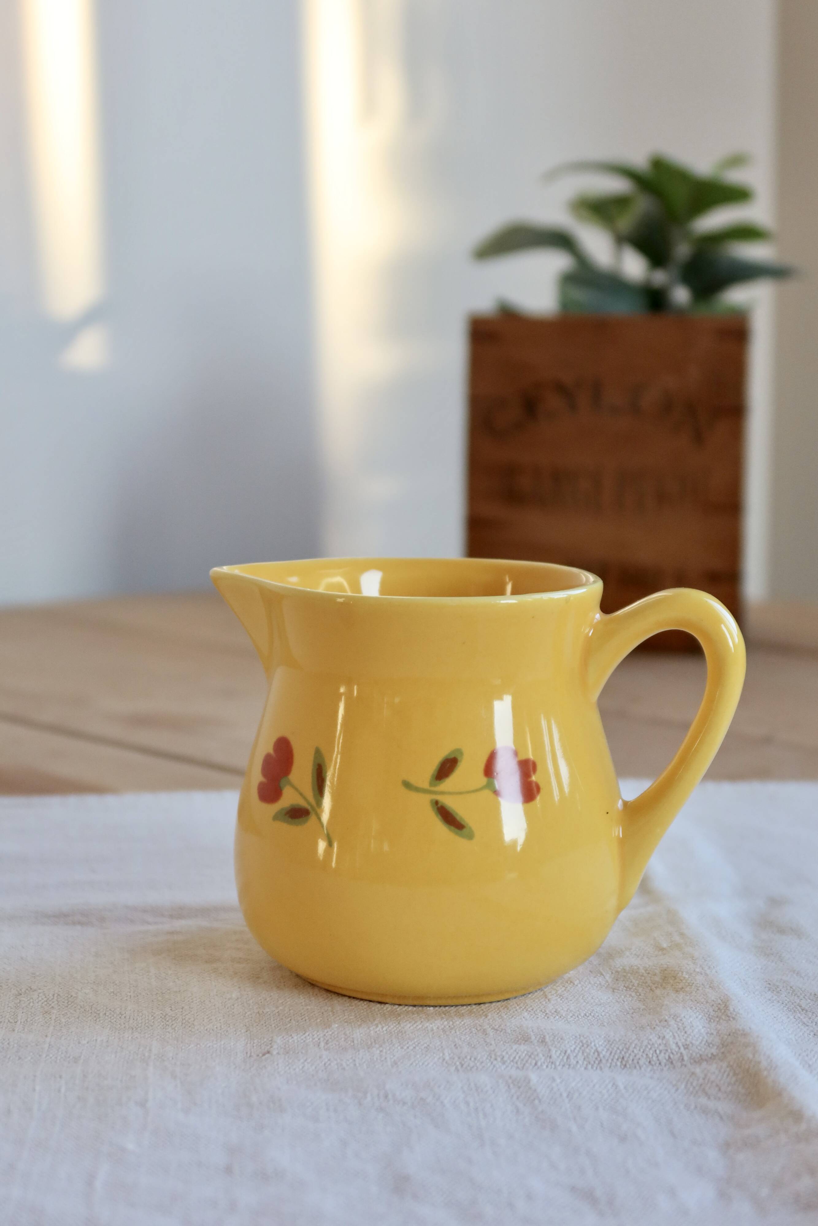 Vintage yellow ceramic milk jug – Hand-painted floral pattern