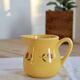 Vintage yellow ceramic milk jug – Hand-painted floral pattern