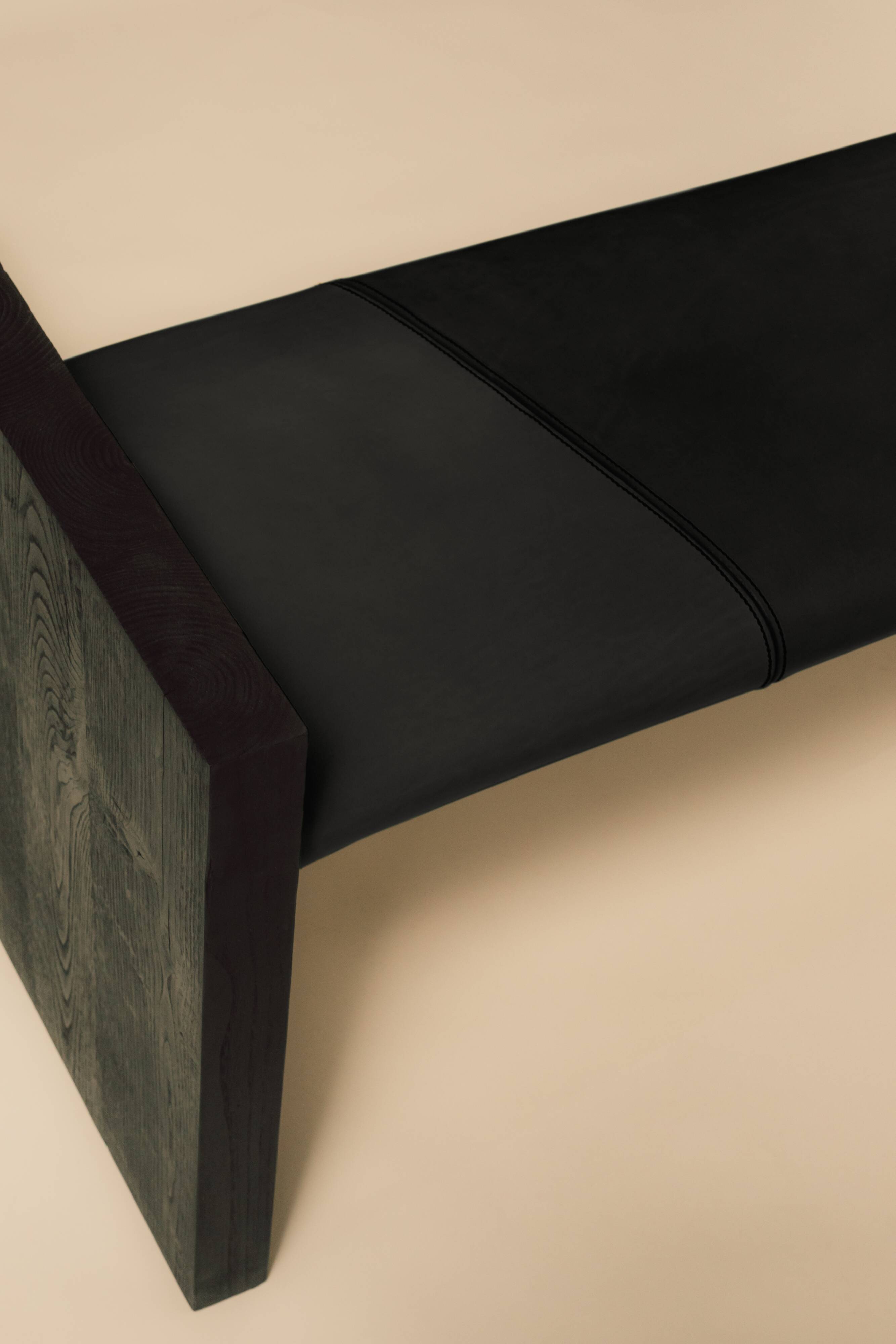 Maërl SEPIA bench, ebonized chestnut and black leather.