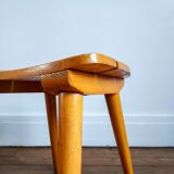 Small curved wooden stool