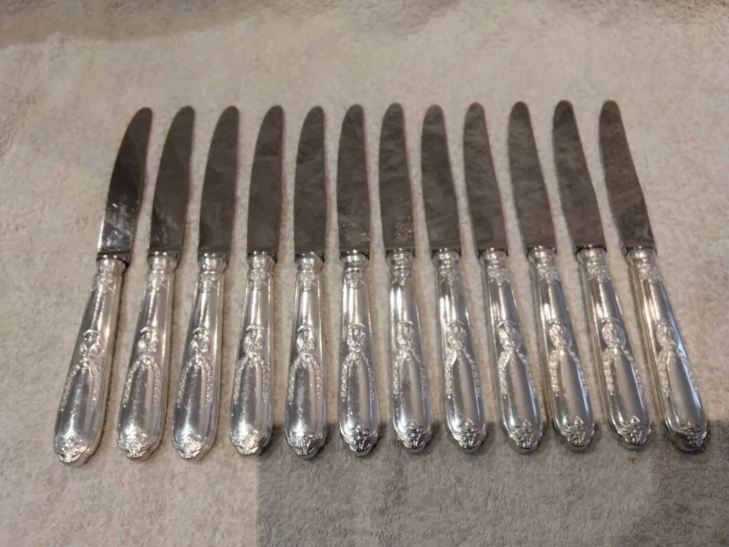 12 silver-plated metal table knives by the silversmith Ravinet Denfert, Empire style, model 81.