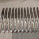 12 silver-plated metal table knives by the silversmith Ravinet Denfert, Empire style, model 81.