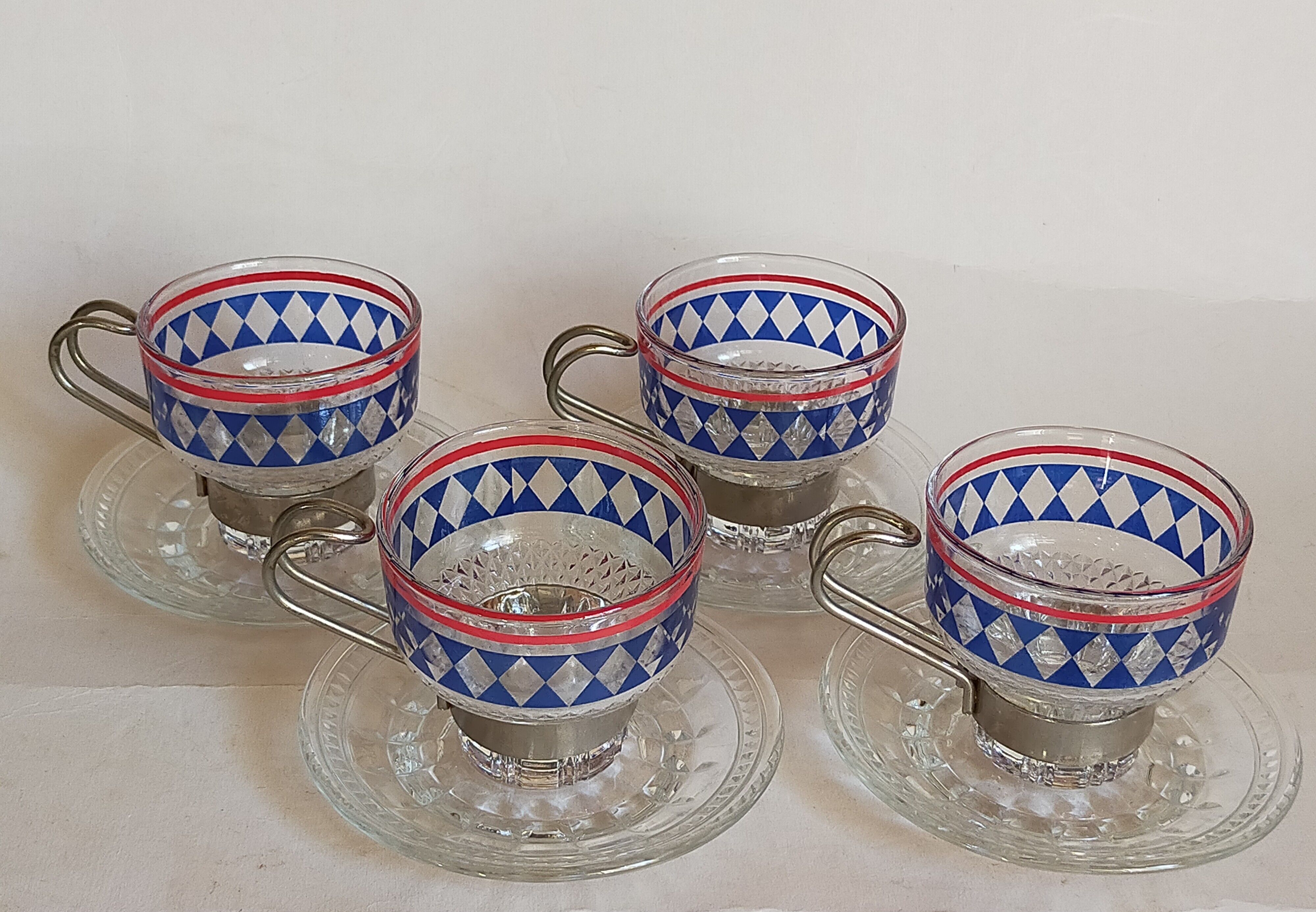 Four vintage coffee cups screen printed glass and metal