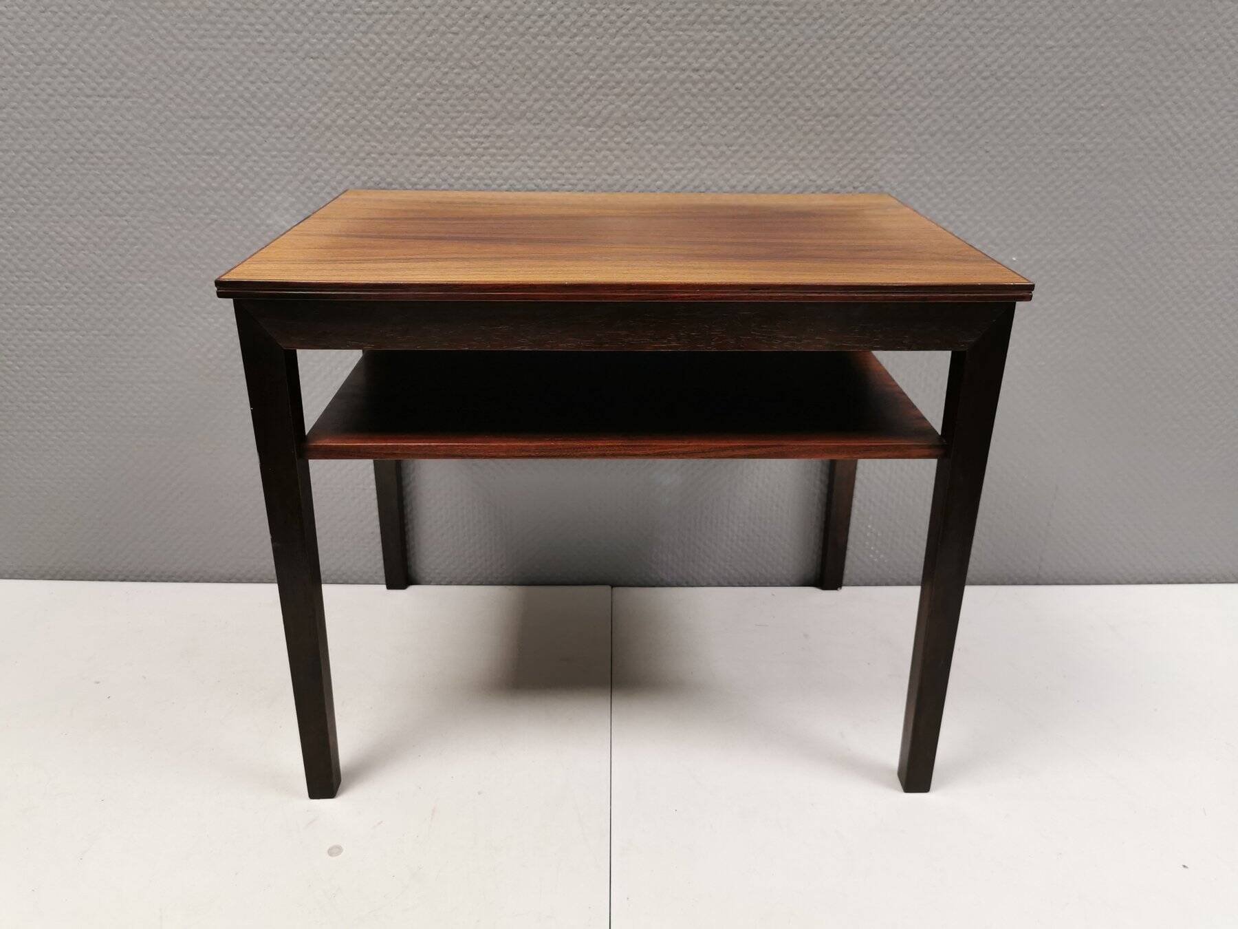 Nice side table in rosewood, probably Danish and from the 60s.