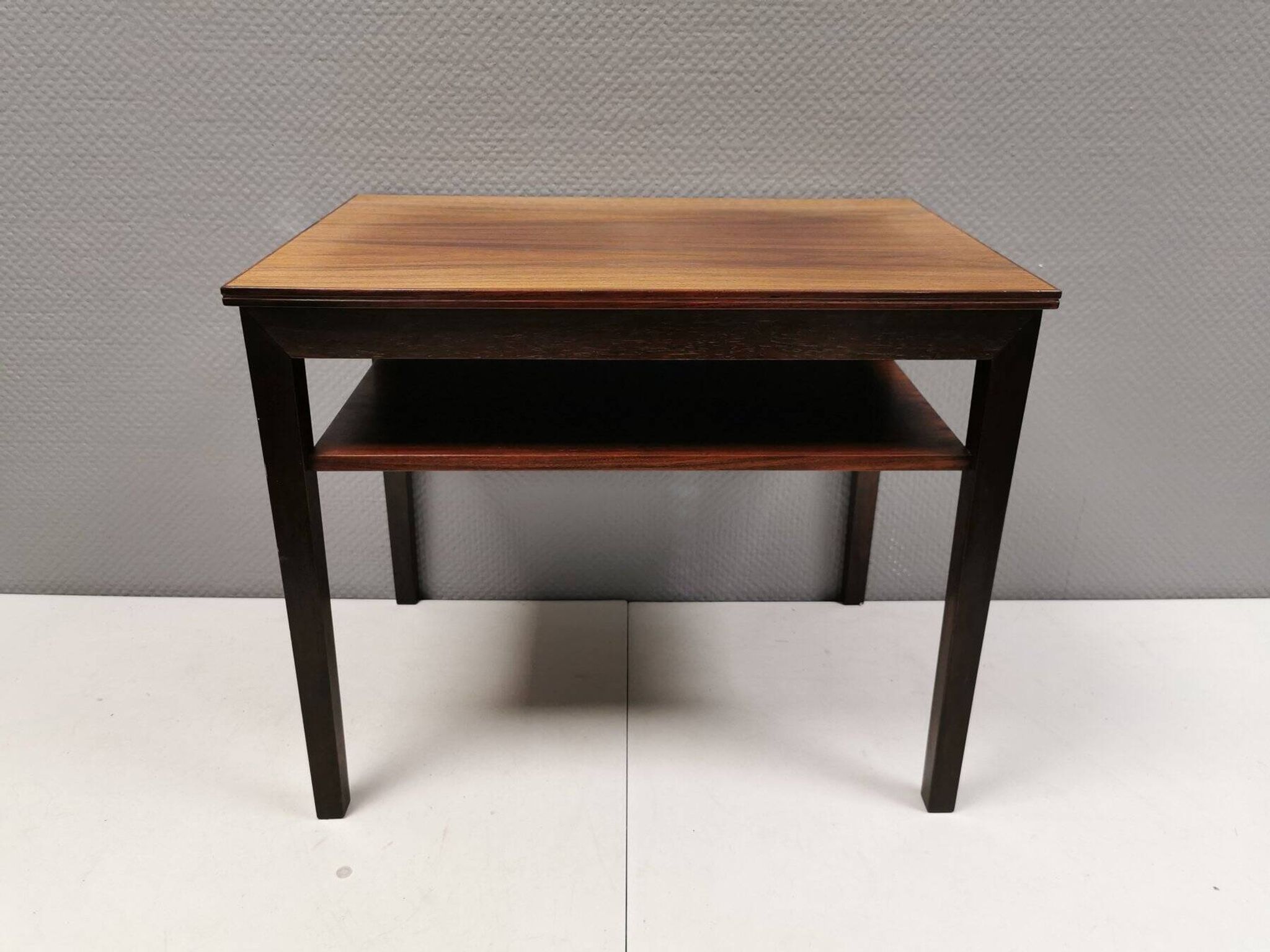 Nice side table in rosewood, probably Danish and from the 60s.