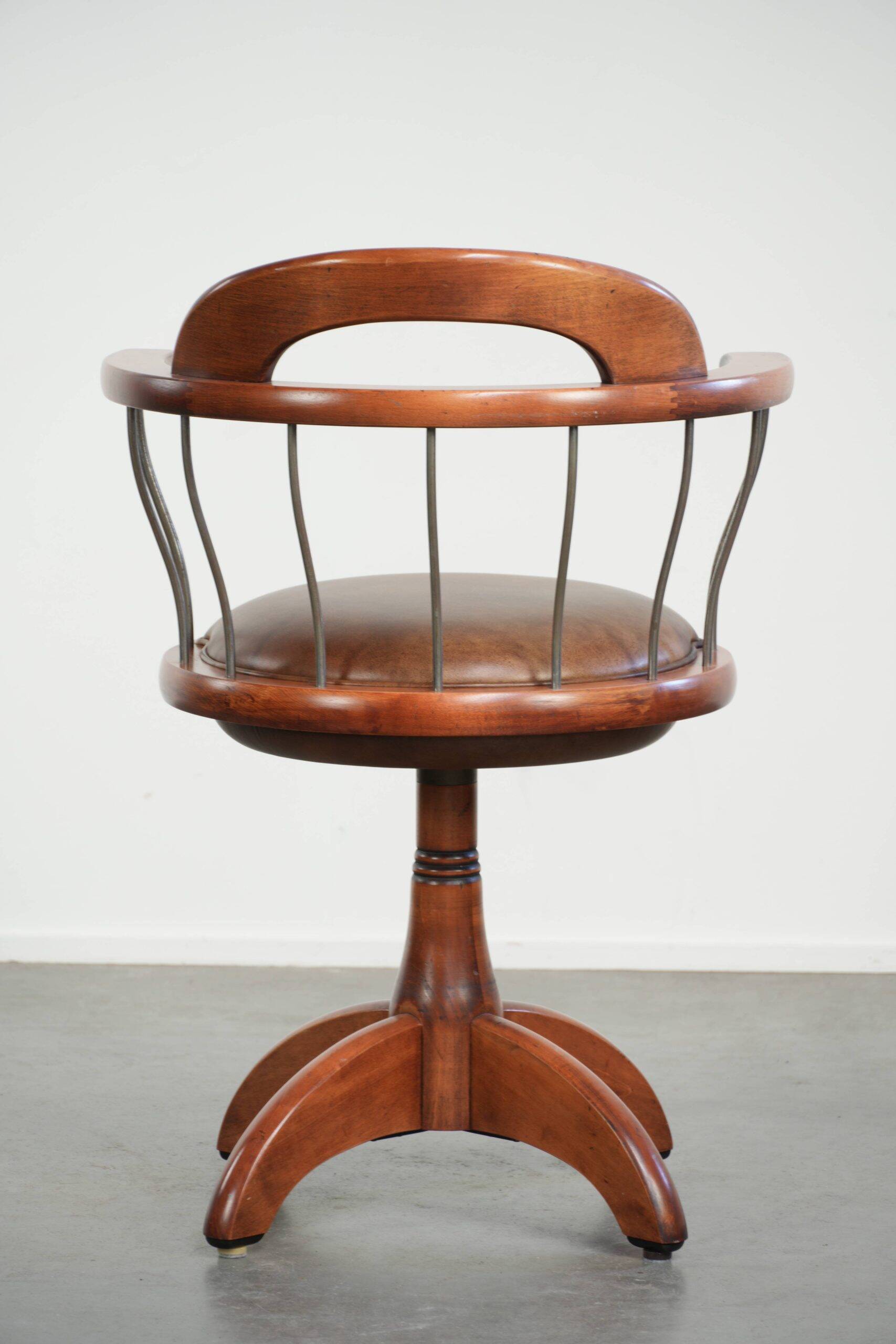 Swivel side chair / office chair with a cognac-coloured cow leather seat