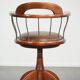 Swivel side chair / office chair with a cognac-coloured cow leather seat