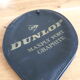 Wooden Dunlop tennis racket with its cover