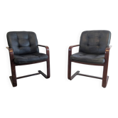 Pair of vintage cantilever armchairs in rosewood veneer.