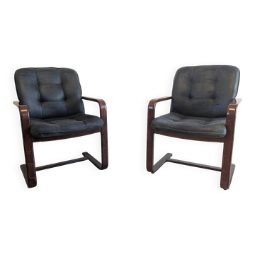 Pair of vintage cantilever armchairs in rosewood veneer.