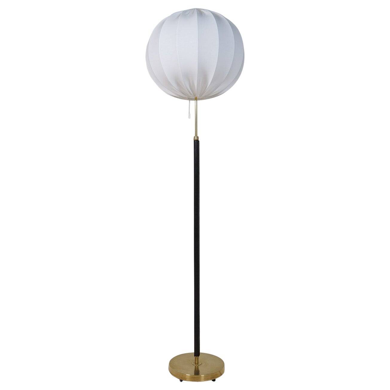 Mid-century black leather and brass floor lamp by Falkenbergs Belysning, Sweden, 1960s.