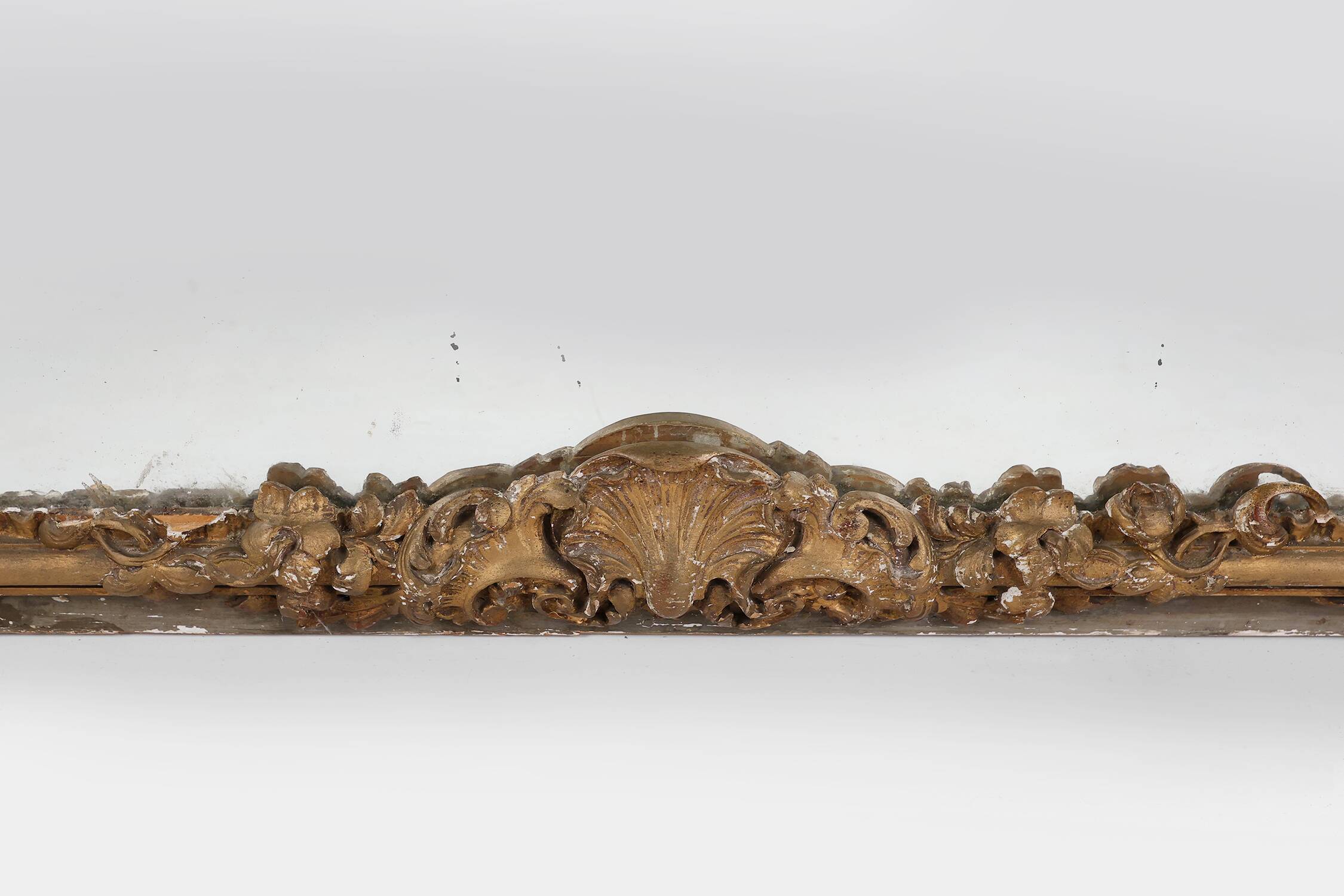 Large baroque decorated chimney mirror in gilted wood, France ca. 1800
