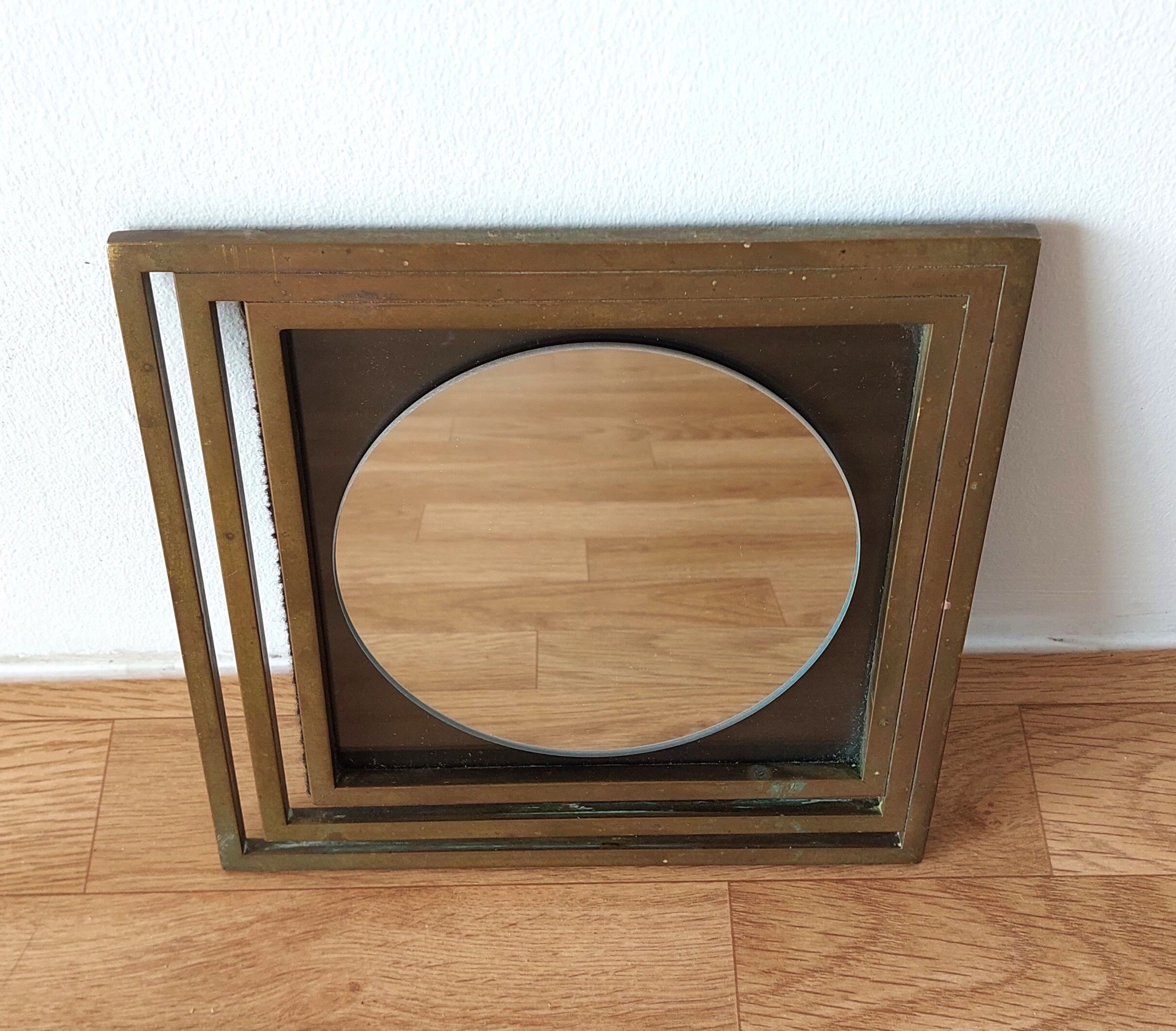 Modernist mirror in gilded brass 1960.