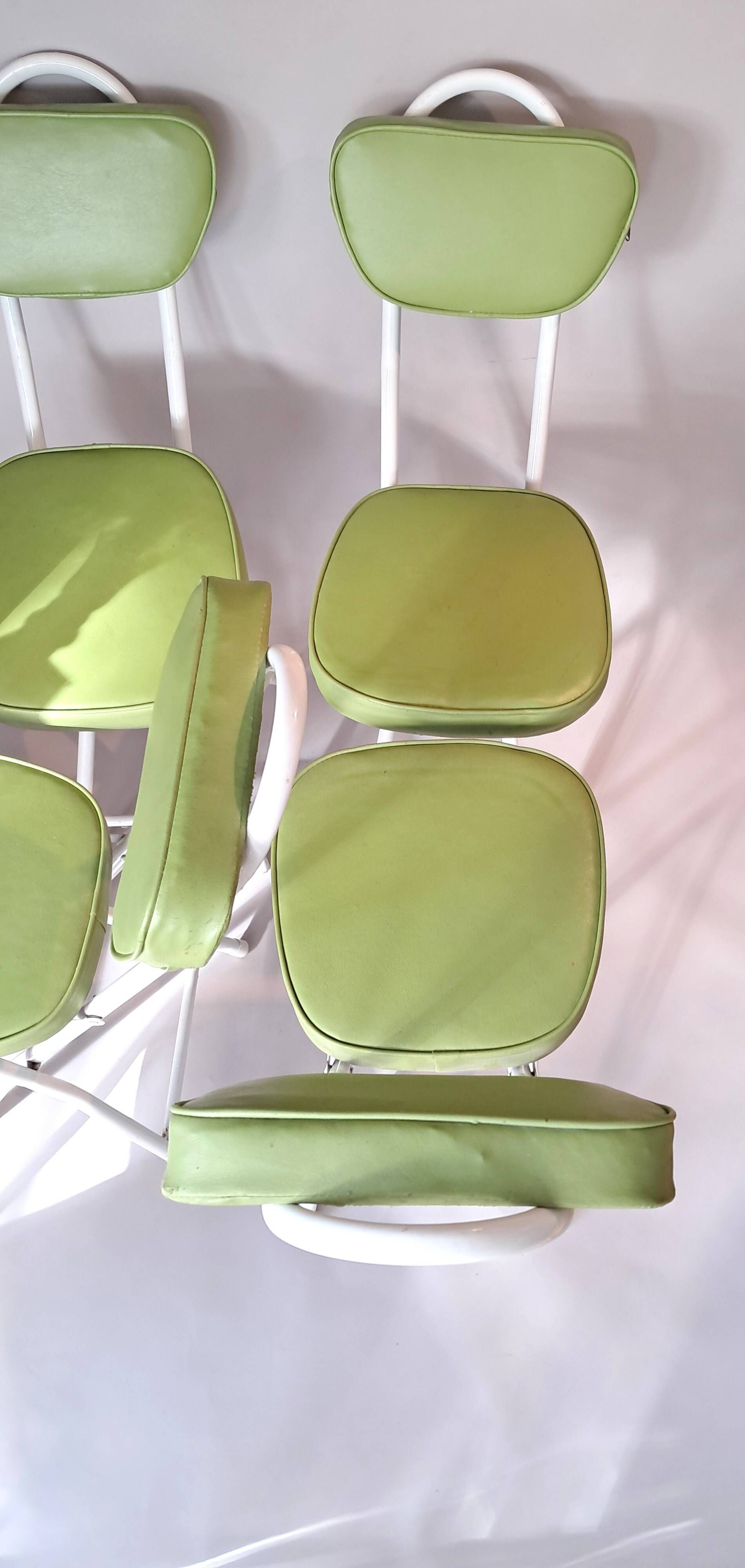 Set of 4 folding cocktail chairs in olive green faux leather from the 1970s.