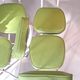 Set of 4 folding cocktail chairs in olive green faux leather from the 1970s.