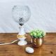 Porcelain table lamp and glass globe
