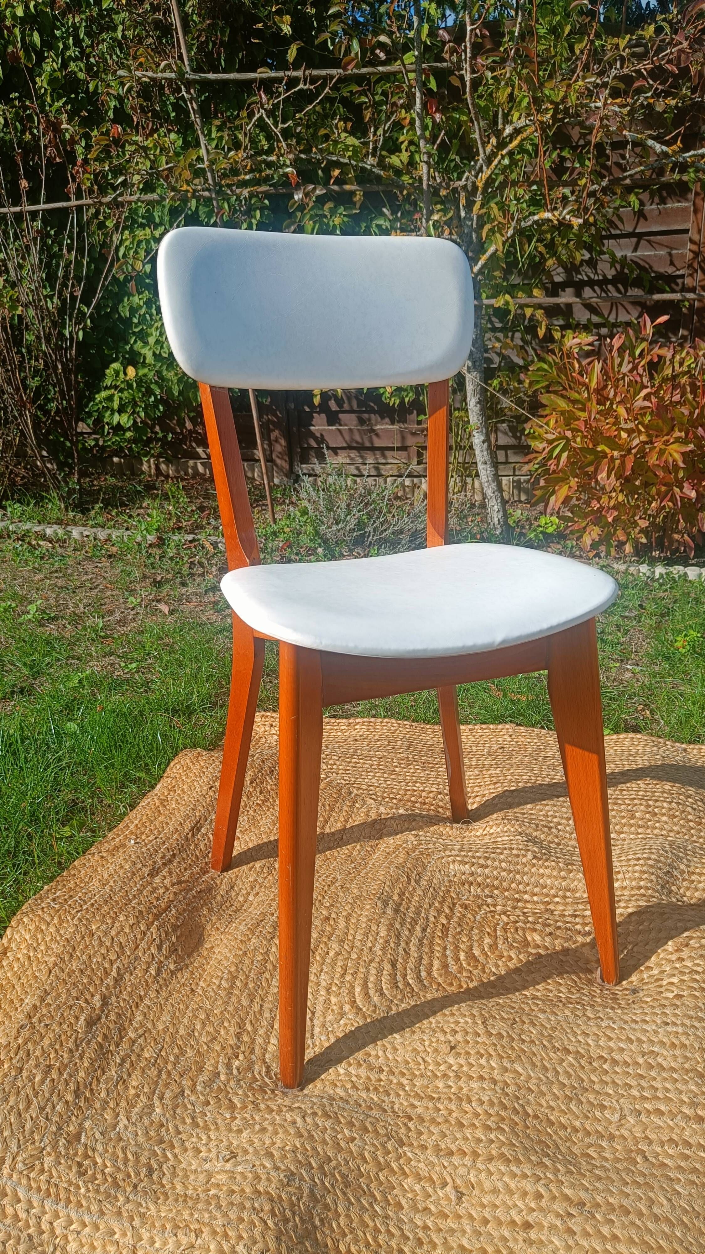 vintage wooden chairs with white faux leather