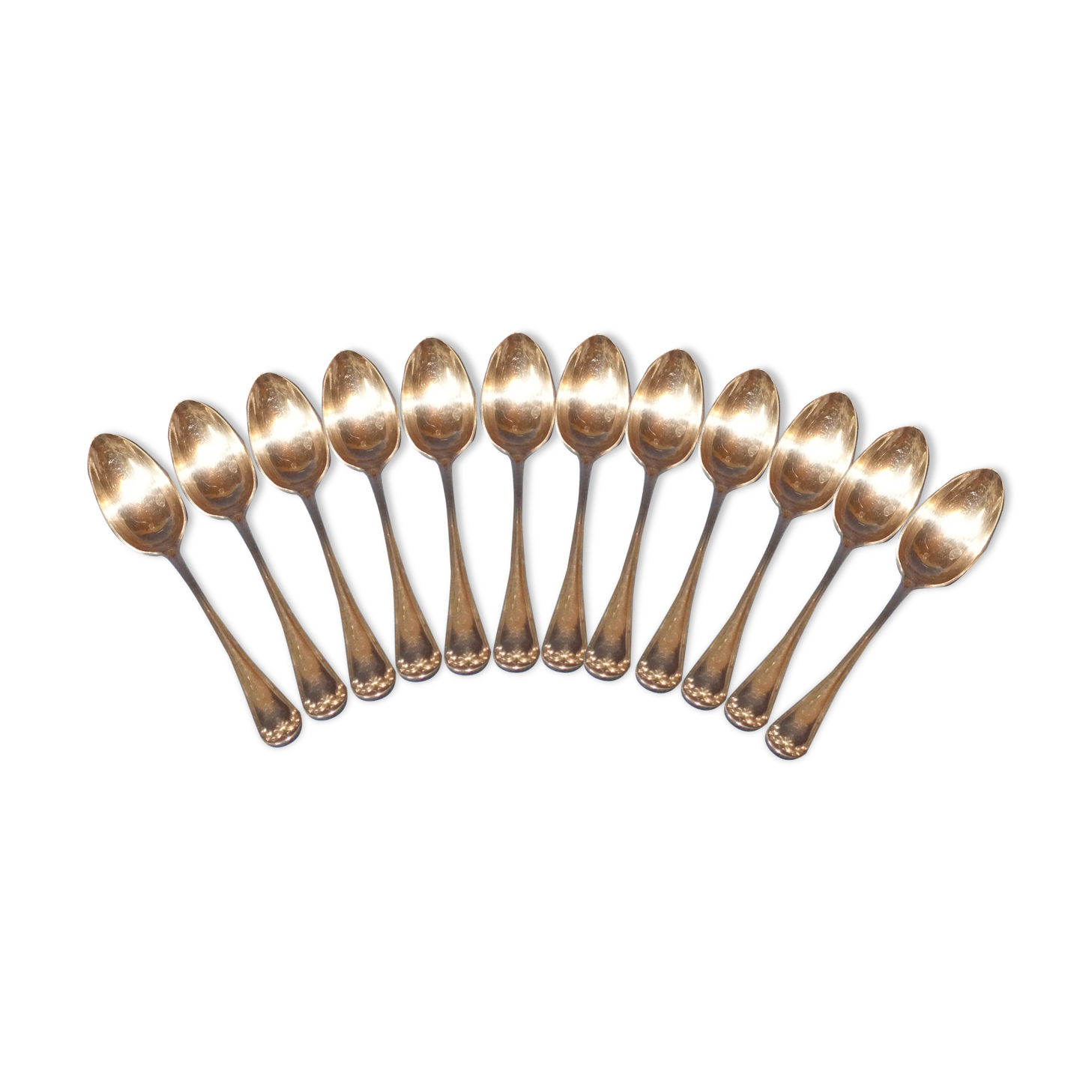 Old box of 12 small white metal spoons