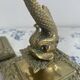 Pair of brass dolphin candlesticks, late 19th century, Napoleonic period