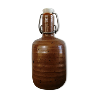Old bottle of varnished sandstone